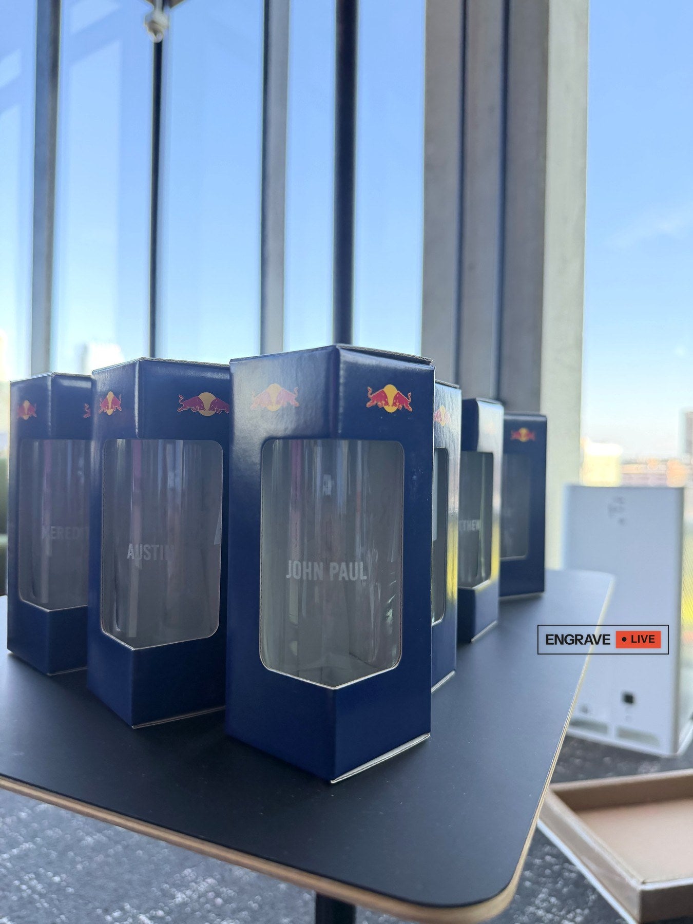 Boxed Red Bull glasses, each engraved with a guest's name, at the McDonald's headquarters launch